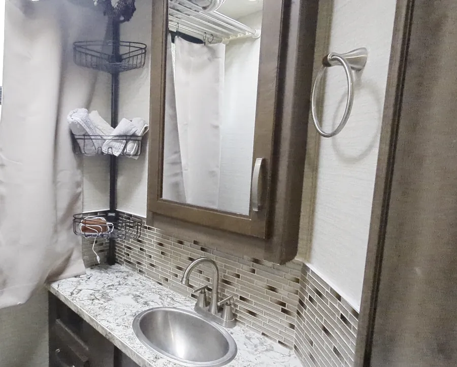 The bathroom sink and mirror